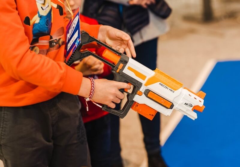 kid holding nerf gun