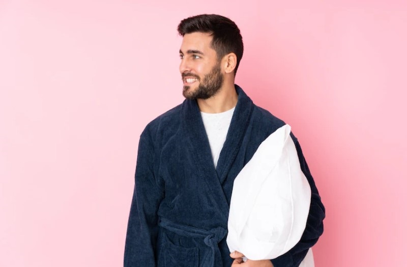 boy hold pillow and wearing night dress