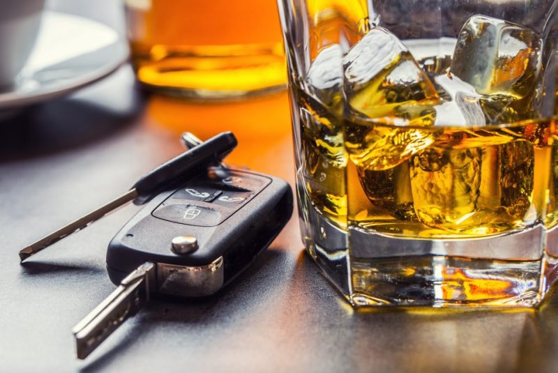 car keys with a glass on the table