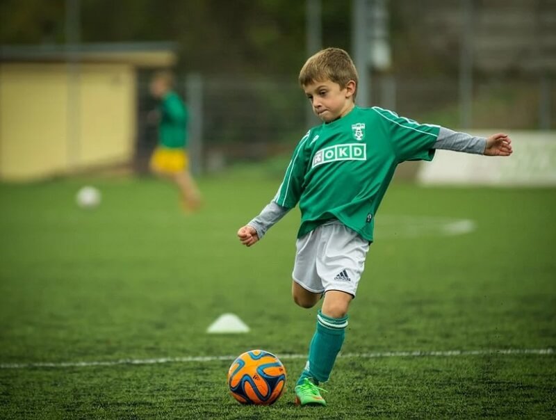 child playing a football