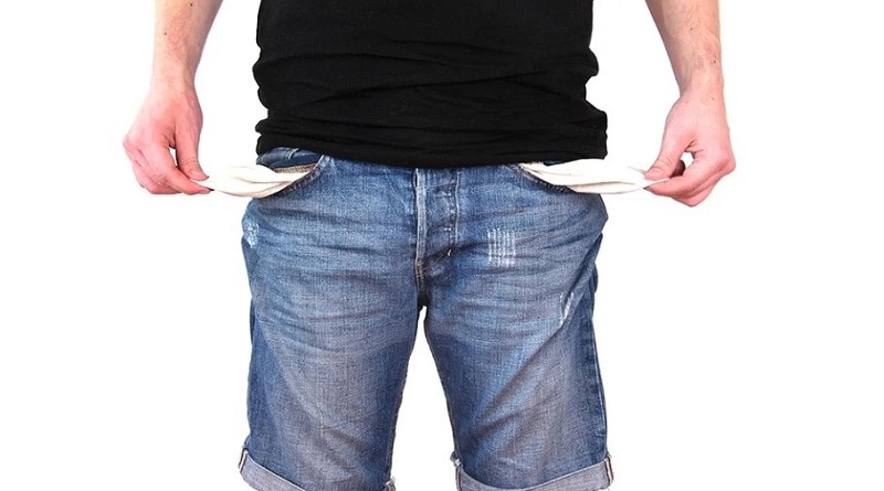 Boy showing his empty pockets