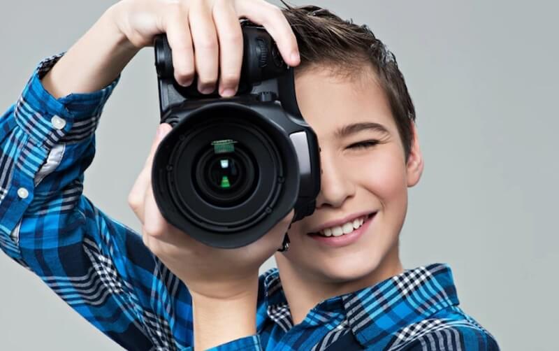 boy hand holding a camera