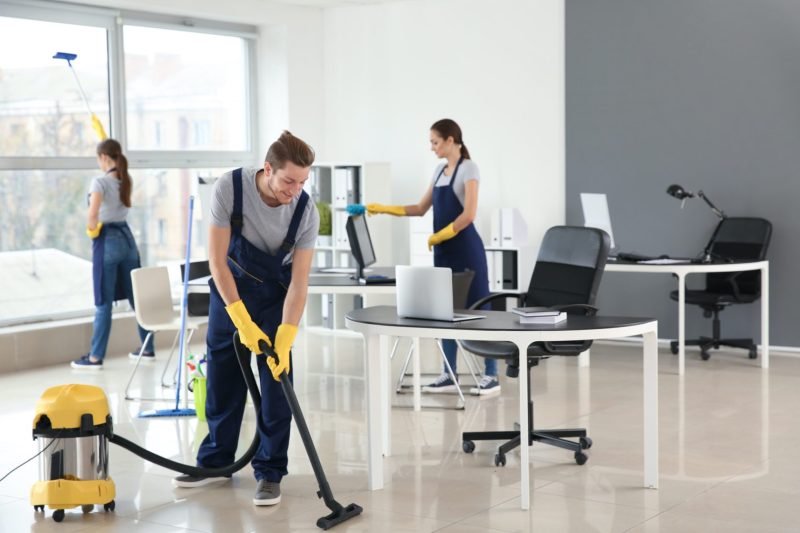 persons cleaning the house with vaccum cleaners