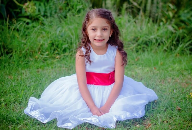cute little girl wearing white frok